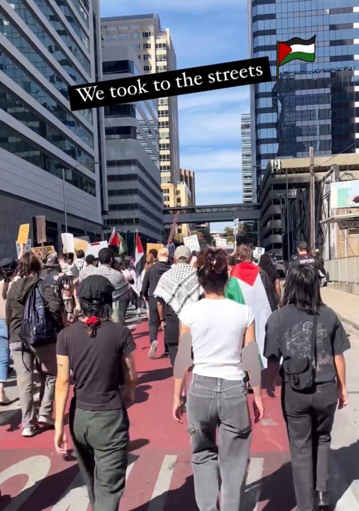 a picture of a crowd of pro-palestine protesters marching in the street down congress avenue. An instagram caption reads "we took the streets" with a palestinian flag next to it
